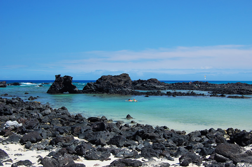 Black Rocks in the White Sand