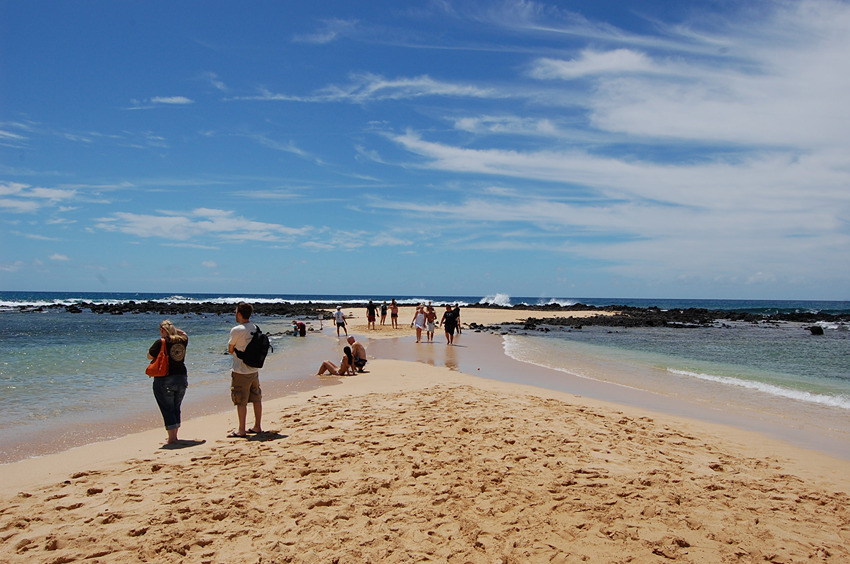 People Exploring the Tombolo Nukumoi Point