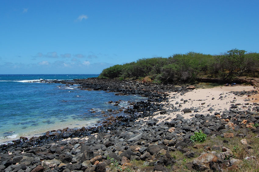 White Sand and Black Lava Rocks