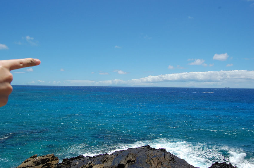 Pointing to Island of Lanai on Horizon